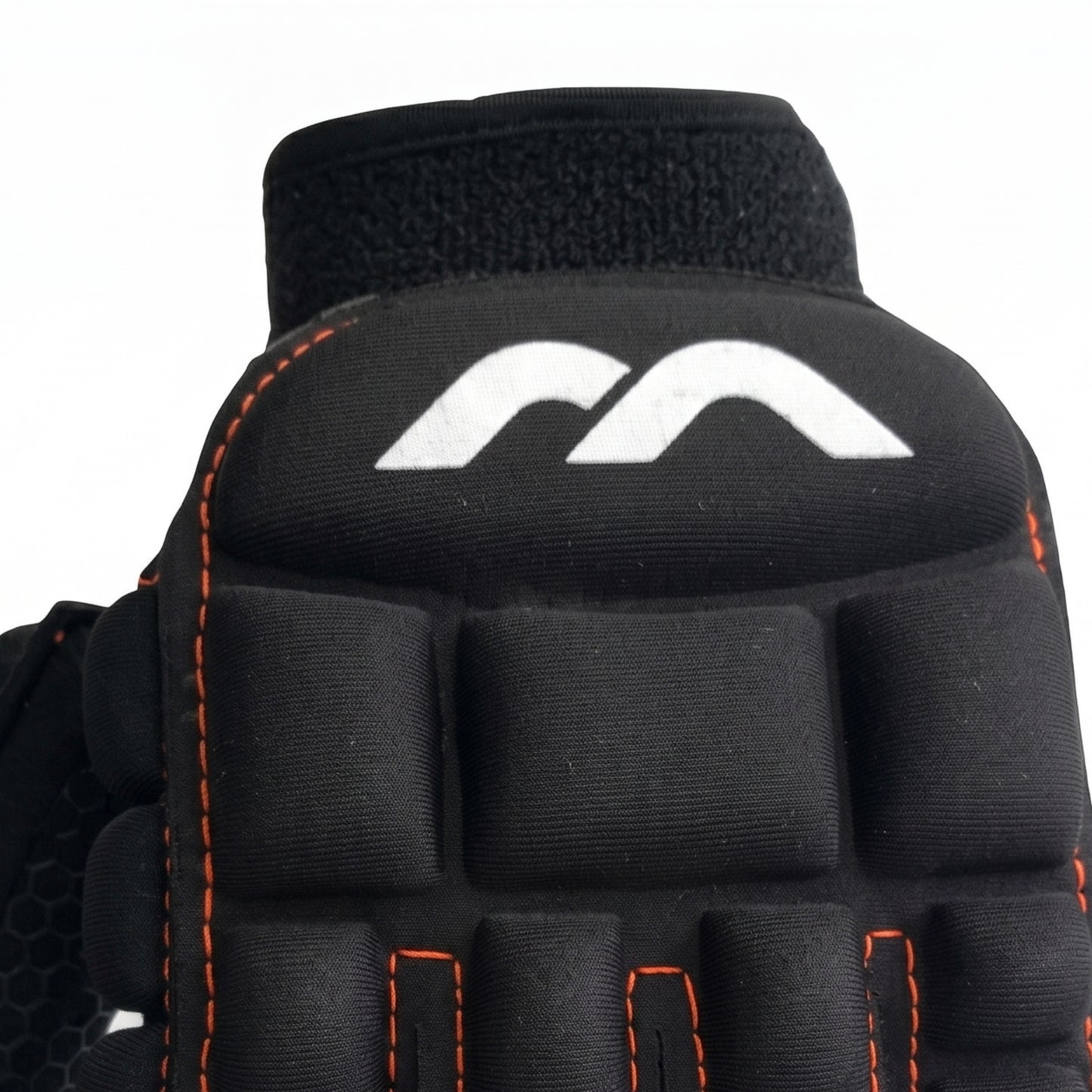 Black Mercian glove with orange stitching on a white background