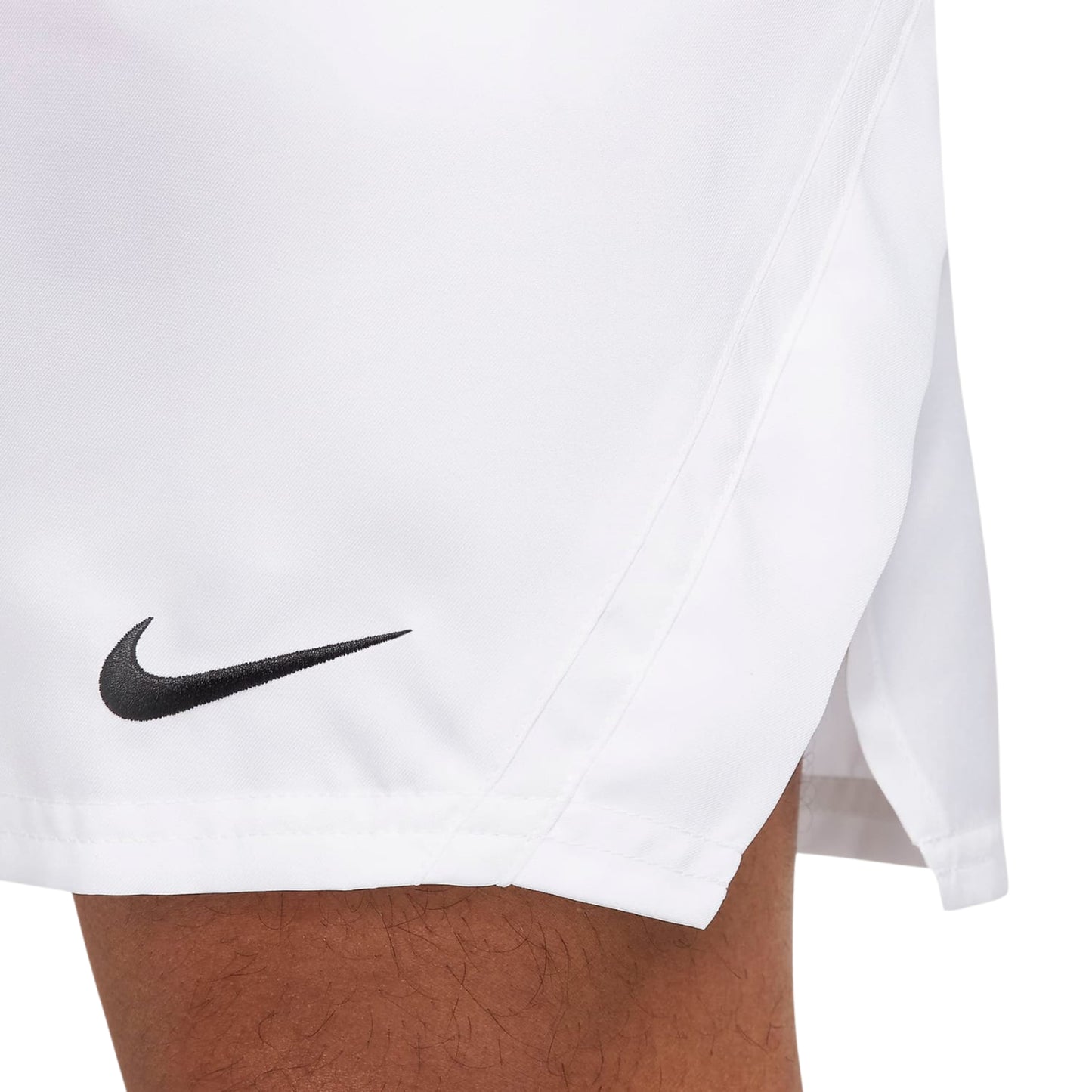 White short with black Nike logo worn by a person, on a white background