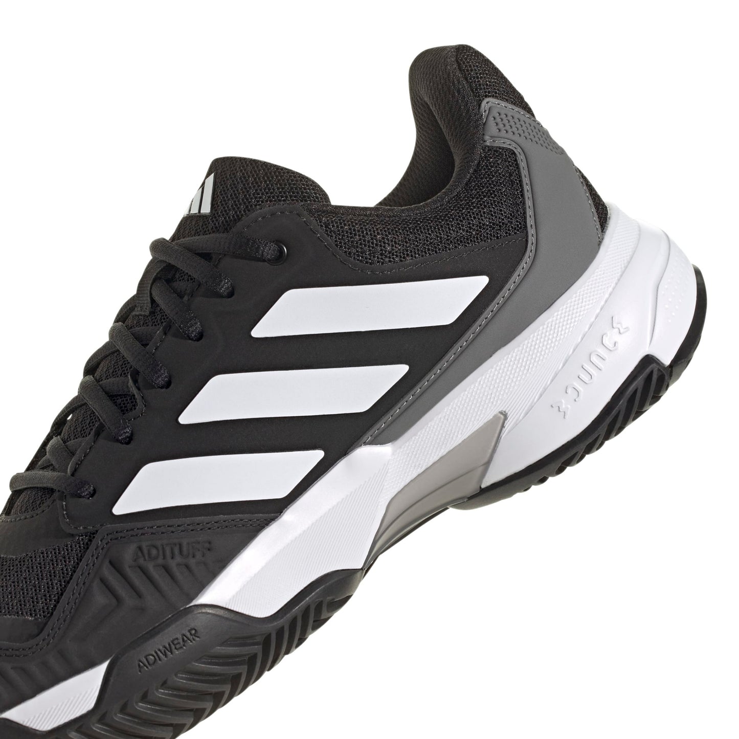 A black and white Adidas tennis shoe with three white stripes on the side, black laces, and a white and gray midsole, shown against a plain white background.