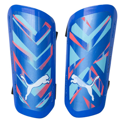 Pair of blue shin guards with Puma logo on a white background