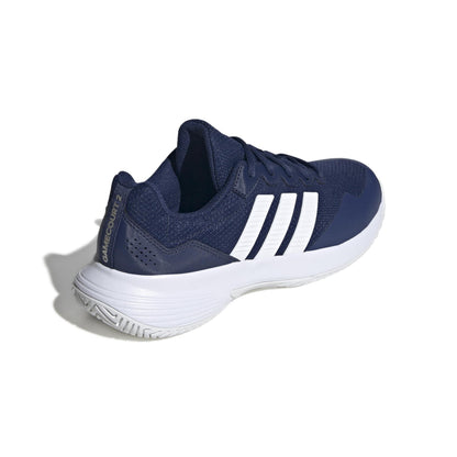 Navy blue tennis shoe with white stripes on a white background