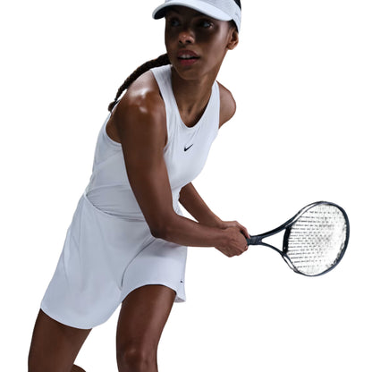 Tennis player in a white outfit with a racket on a white background