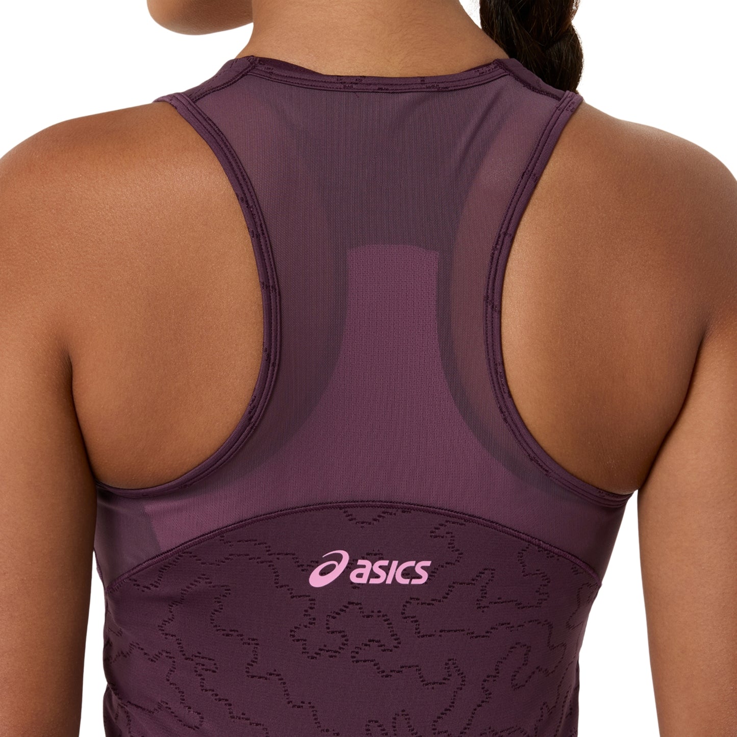 Rear view of a woman wearing an ASICS athletic dress in a deep plum purple color, featuring a pink ASICS logo on the lower back.