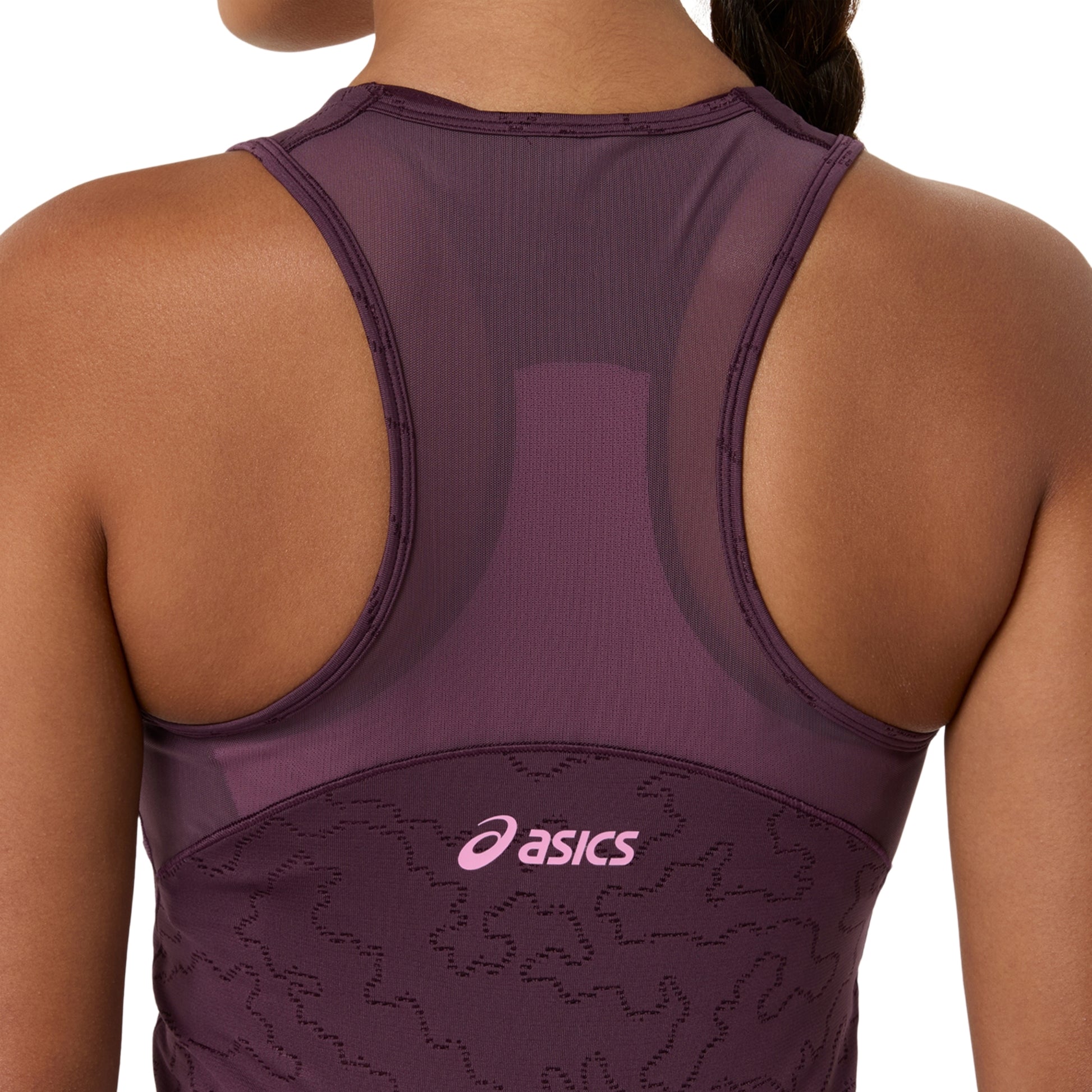 Rear view of a woman wearing an ASICS athletic dress in a deep plum purple color, featuring a pink ASICS logo on the lower back.