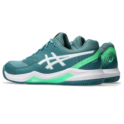Pair of green Asics padel shoe on a white background