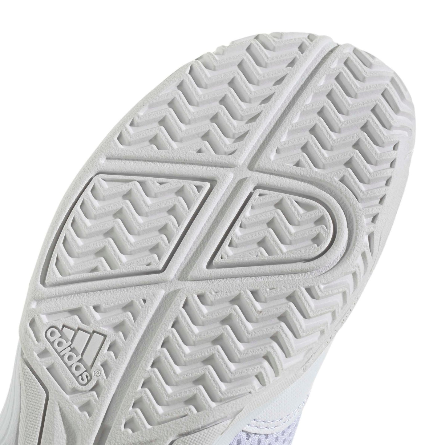 Close-up of the white textured rubber outsole of an Adidas shoe, showing the brand logo and tread pattern on a white background.
