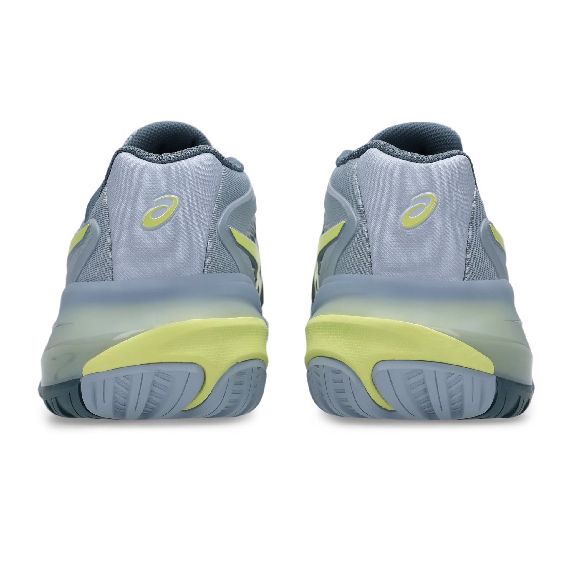 Gray and yellow tennis shoes on a white background