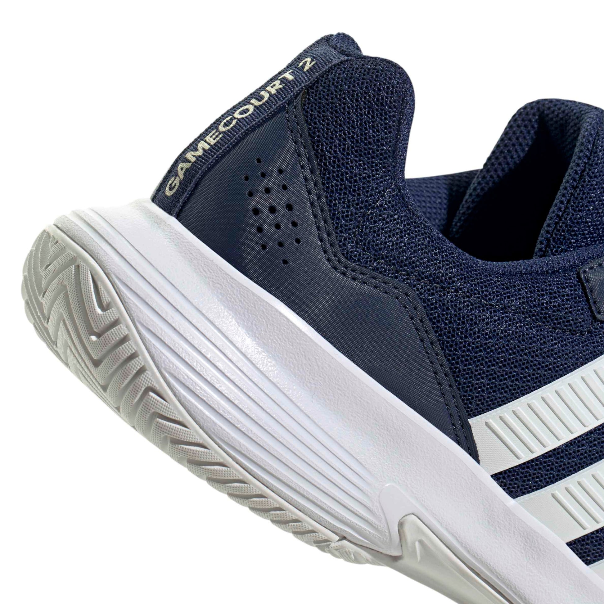 Navy blue and white tennis shoe with 'GameCourt Z' text on a white background