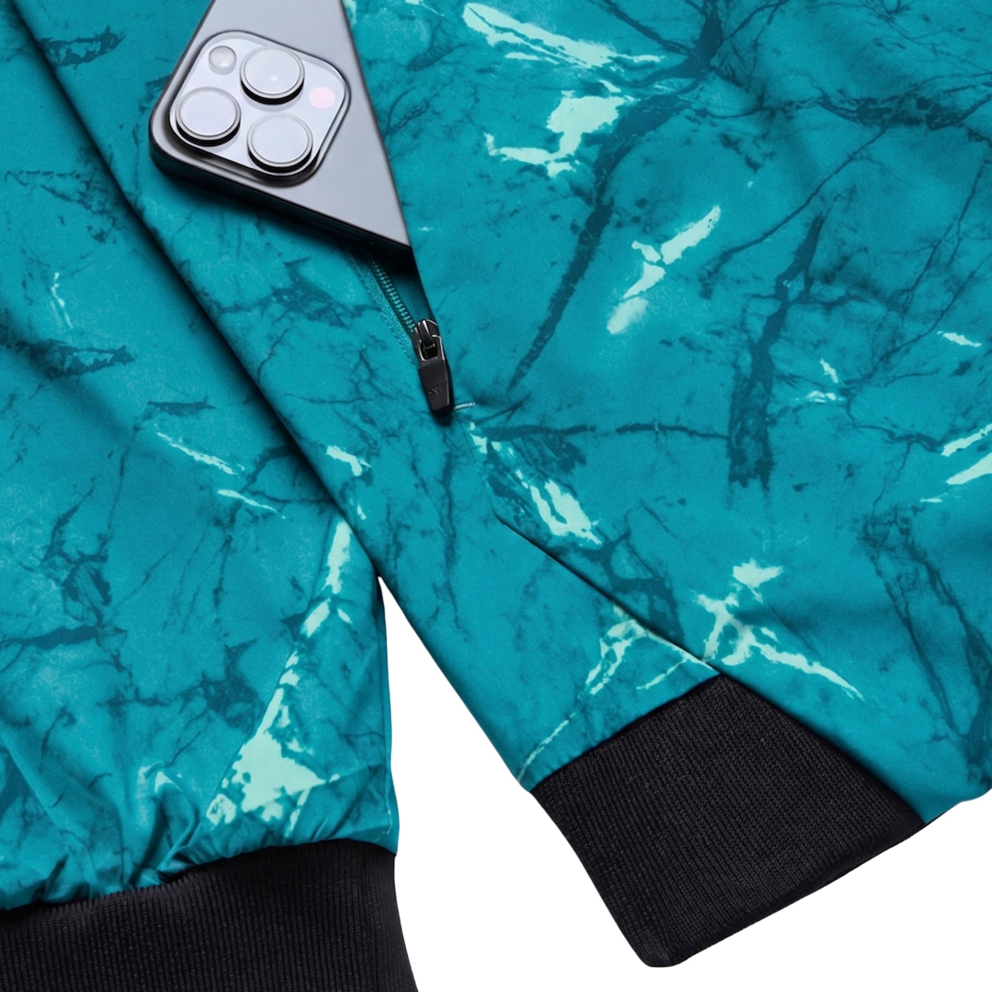 Teal jacket with black zipper and cuffs, phone case in jacket