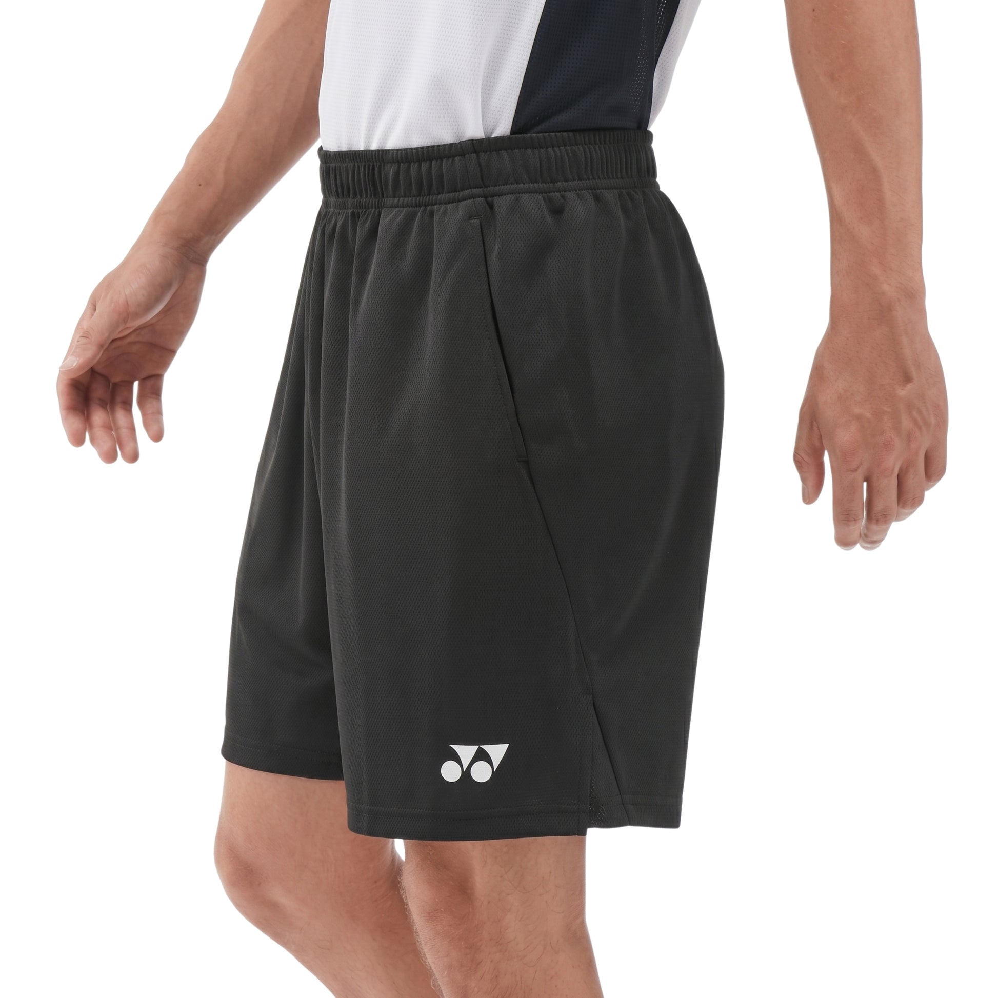 Black Yonex shorts with a logo on a white background