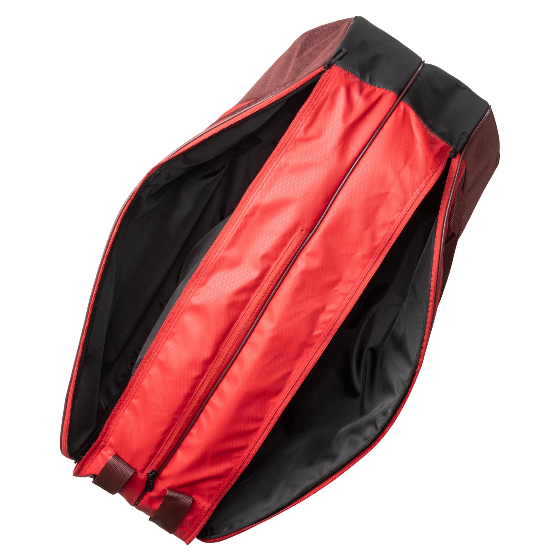Red and black tennis bag with open compartment on a white background