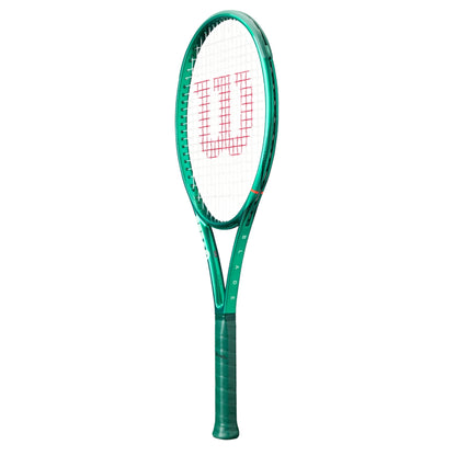 Green Wilson tennis racket with a white strings background on a white background
