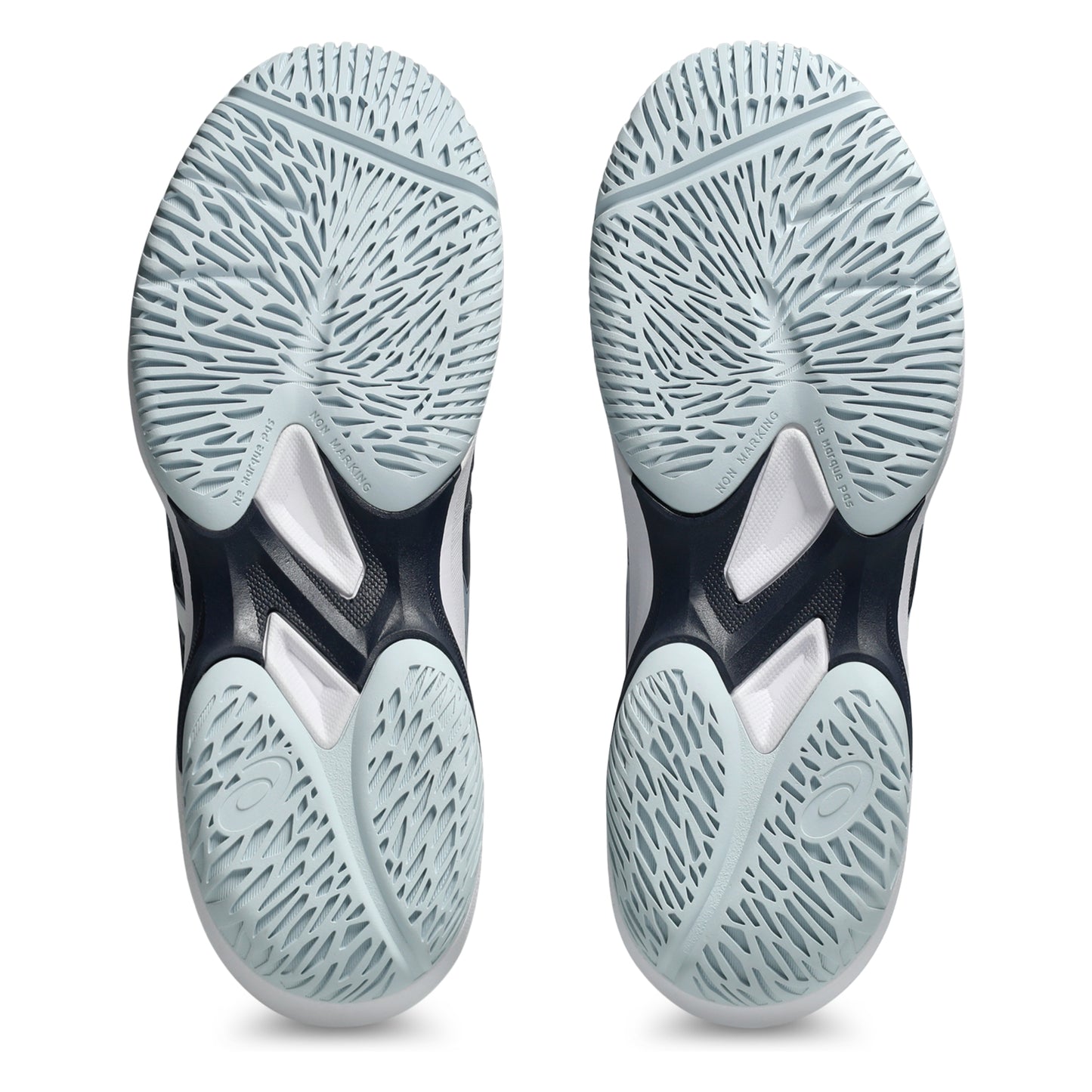 Close-up of a pair of tennis shoes with tread pattern soles on a white background
