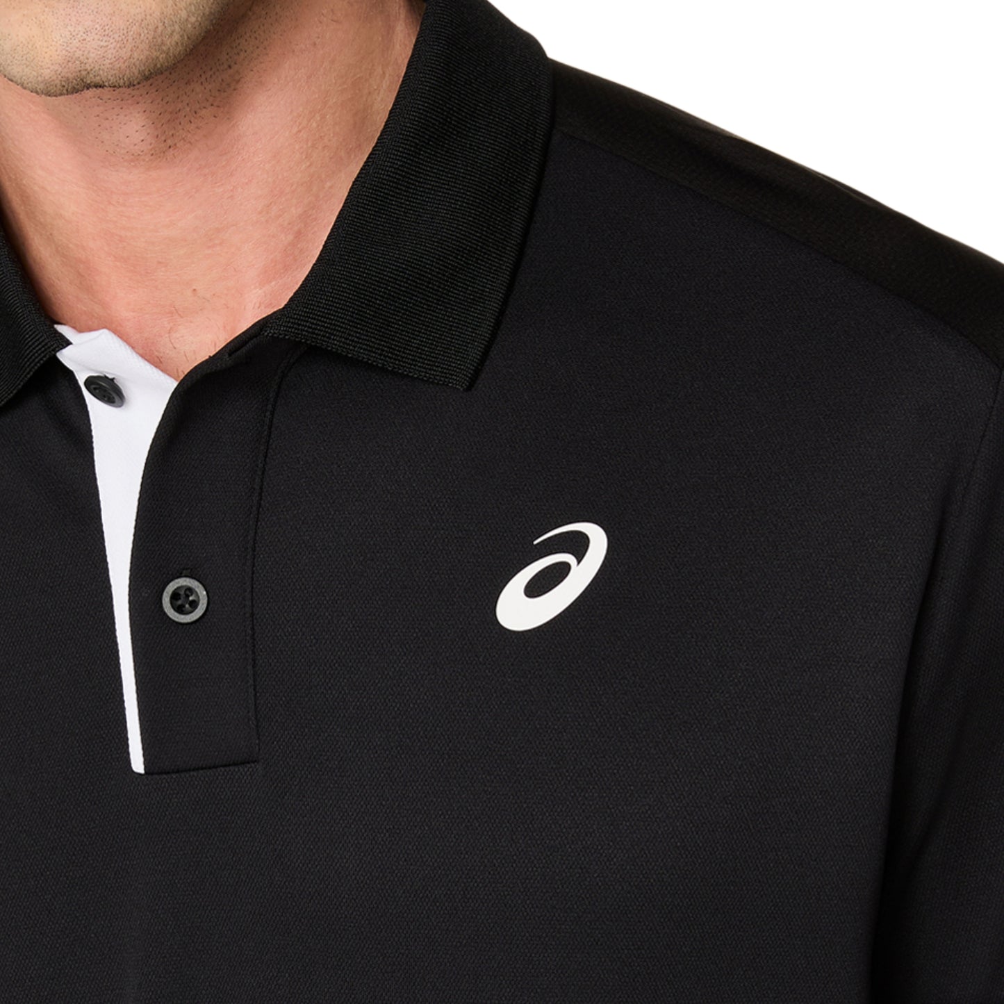 Black polo shirt with a white logo on a white background