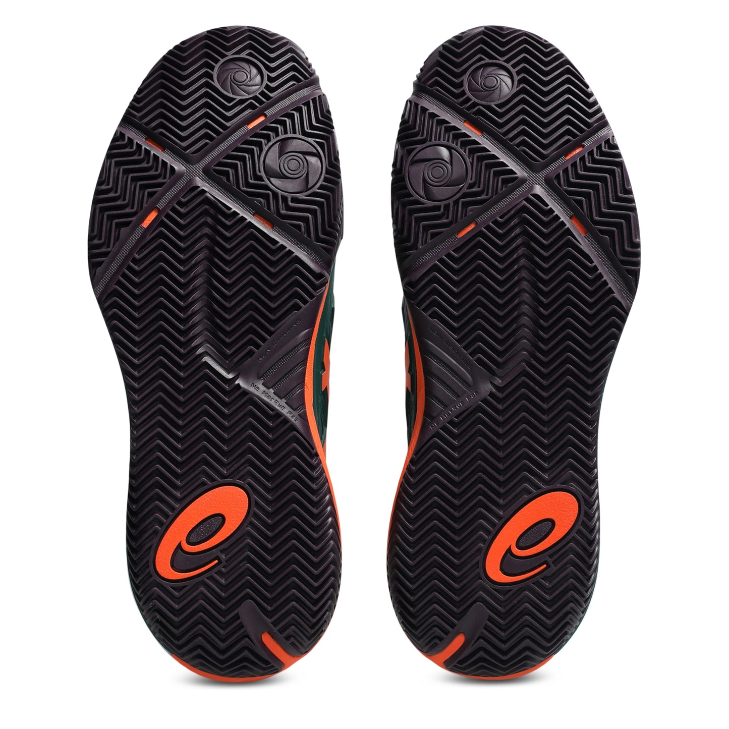 A pair of padel shoes soles shown from the bottom, featuring a black textured chevron pattern with bright orange logo accents and small orange details.