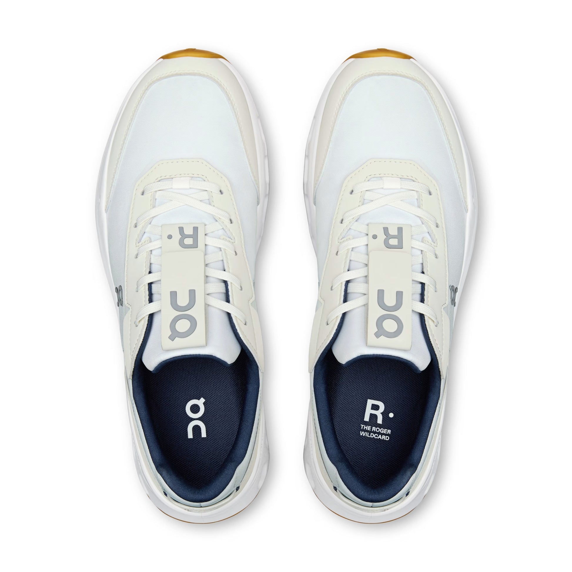 A pair of white and navy blue On tennis shoes shown from a top-down view on a clean white background.
