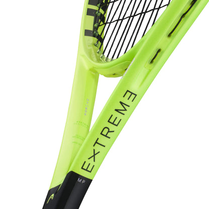 Close-up of a Head tennis racket frame in bright neon yellow-green with black stringing and black printed text reading 'EXTREME' and 'MP' on a white background.