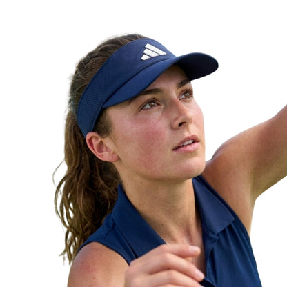 Woman wearing a blue Adidas visor and shirt on a white background