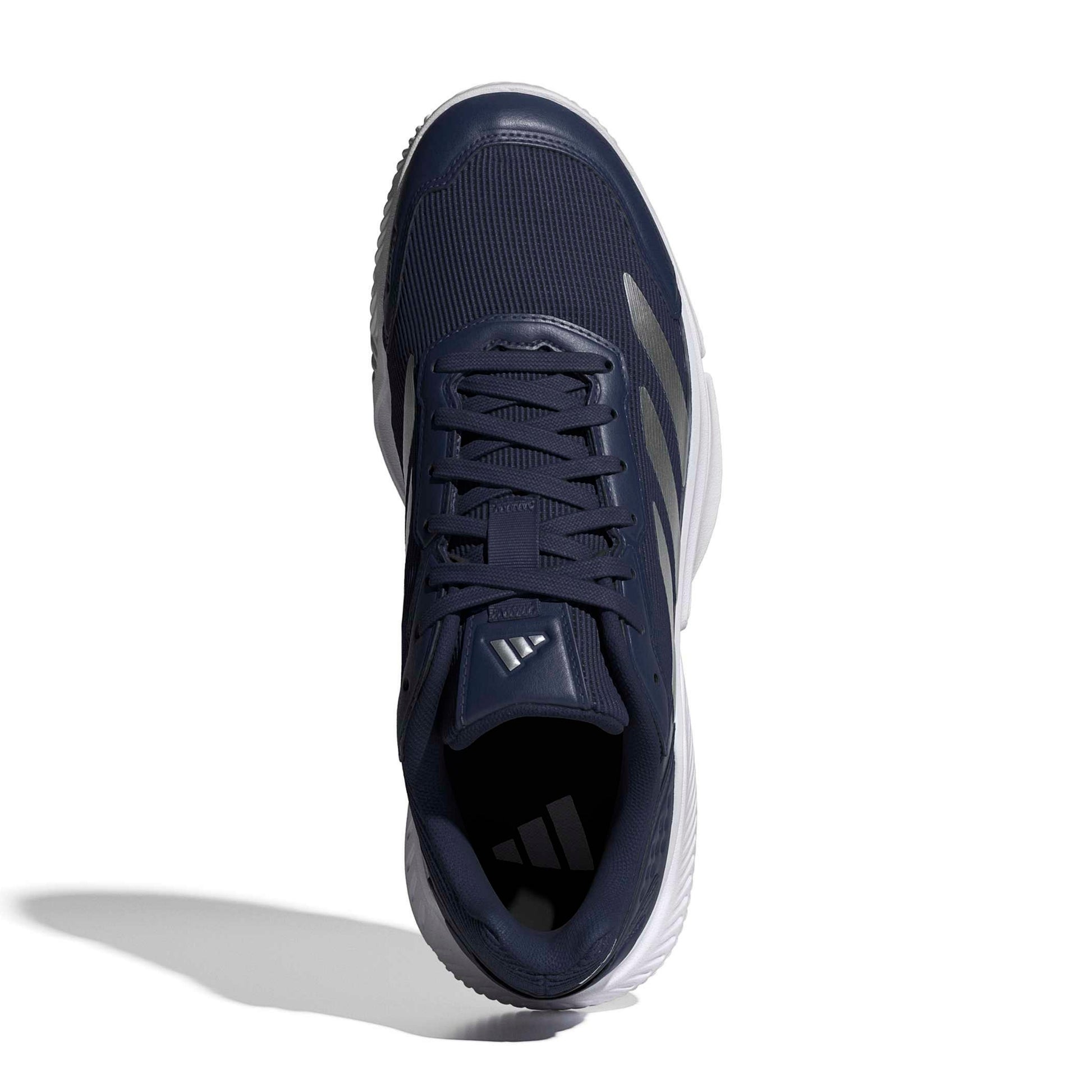 Navy adidas padel shoe with the white logo and a white sole on a white background