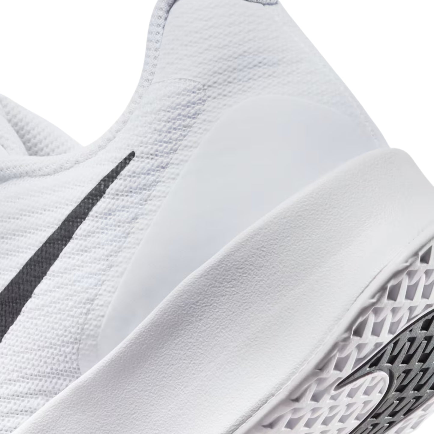 Close-up of a white tennis shoe with a black swoosh logo on a white background