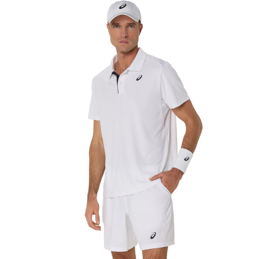 Man wearing a white Asics polo shirt with a cap on a white background