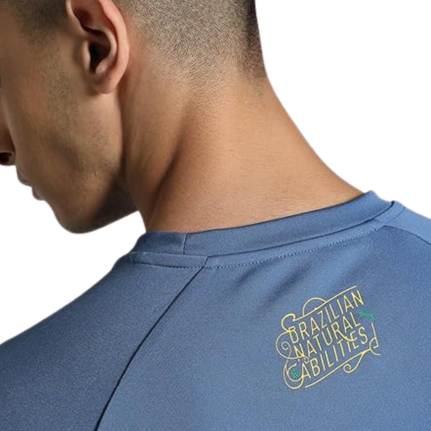 Blue shirt with 'Brazilian Natural Capabilities' logo on a white background