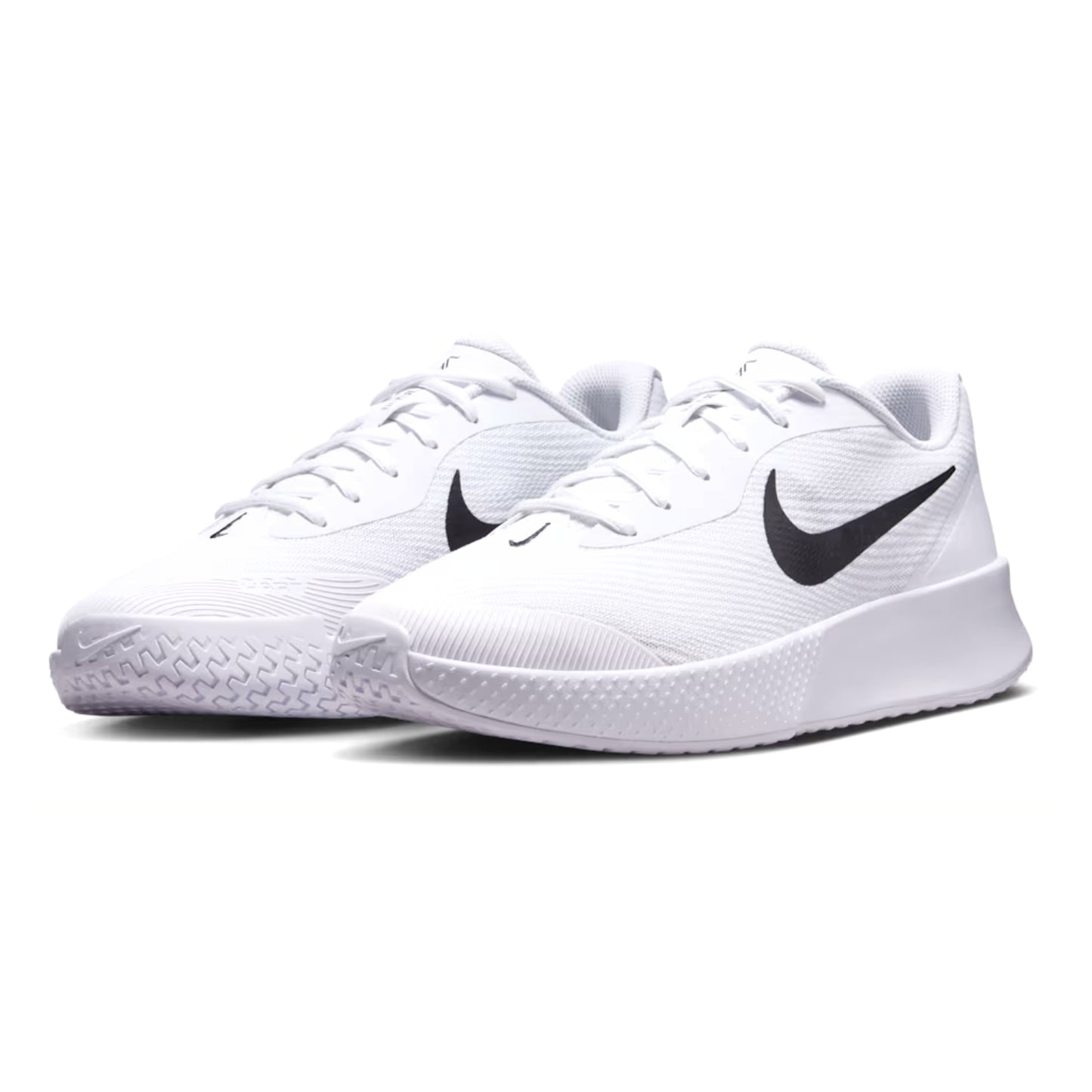White Nike tennis shoes with black swoosh logo on a white background