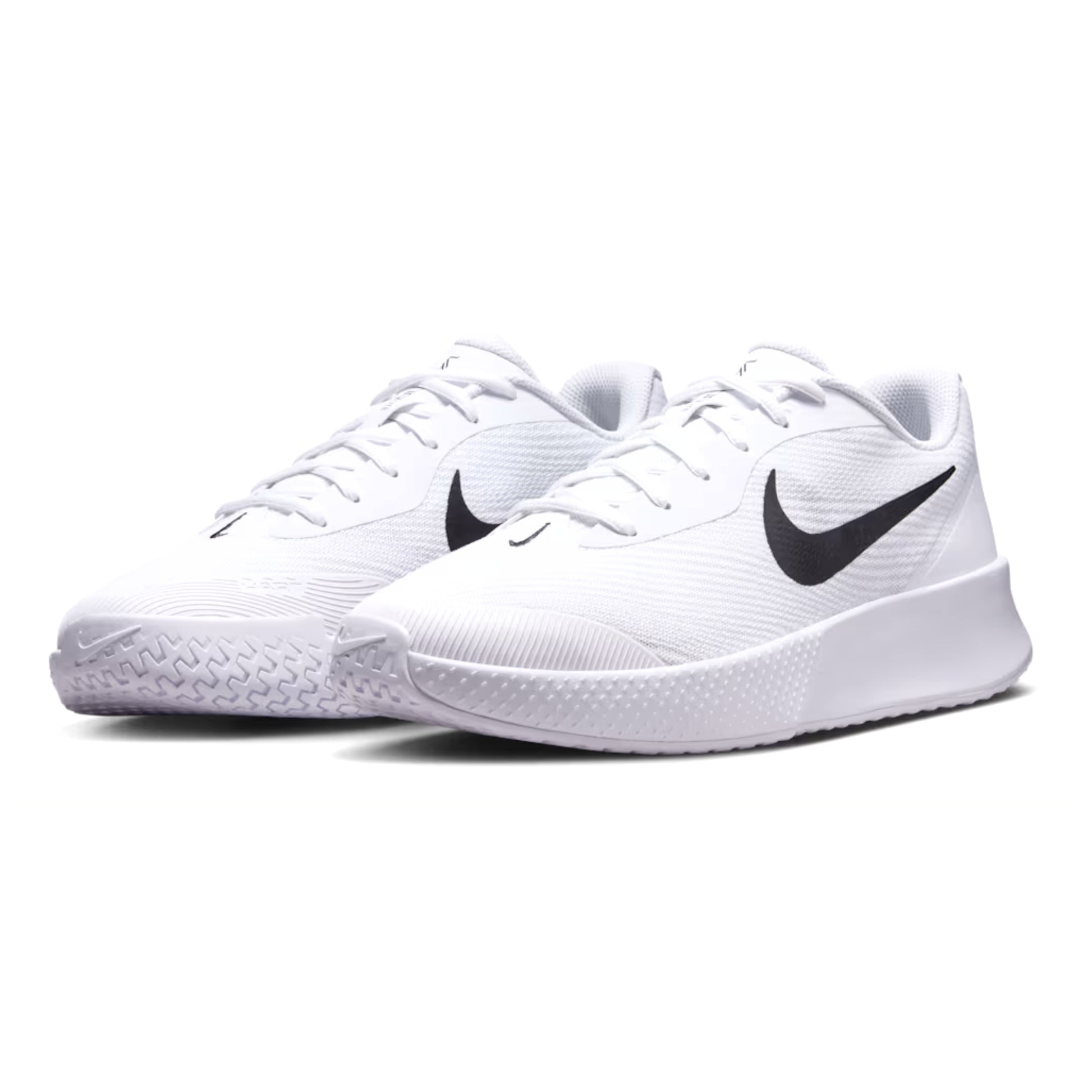 White Nike tennis shoes with black swoosh logo on a white background