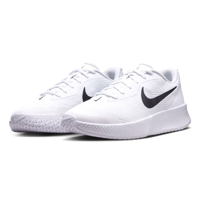 White Nike tennis shoes with black swoosh logo on a white background