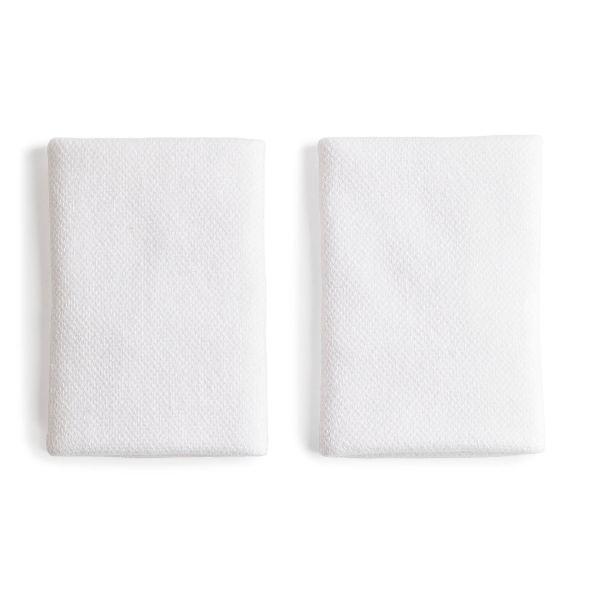Two white wristbands, displayed side-by-side on a clean white background.