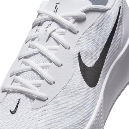 White tennis shoe with black swoosh logo on a white background