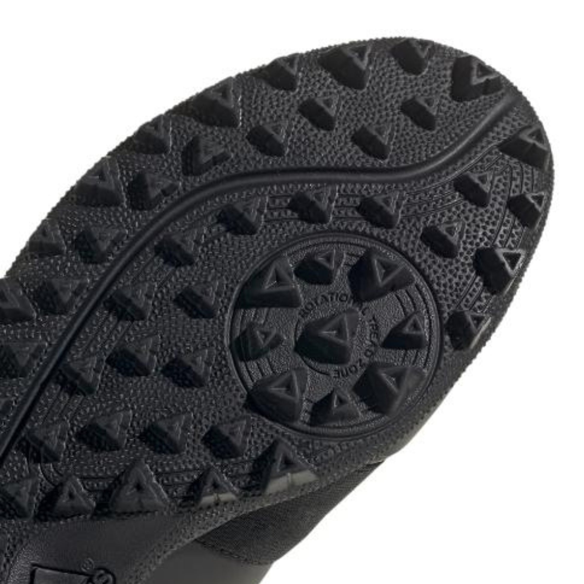 Close-up of a black shoe sole with a brand logo on a white background