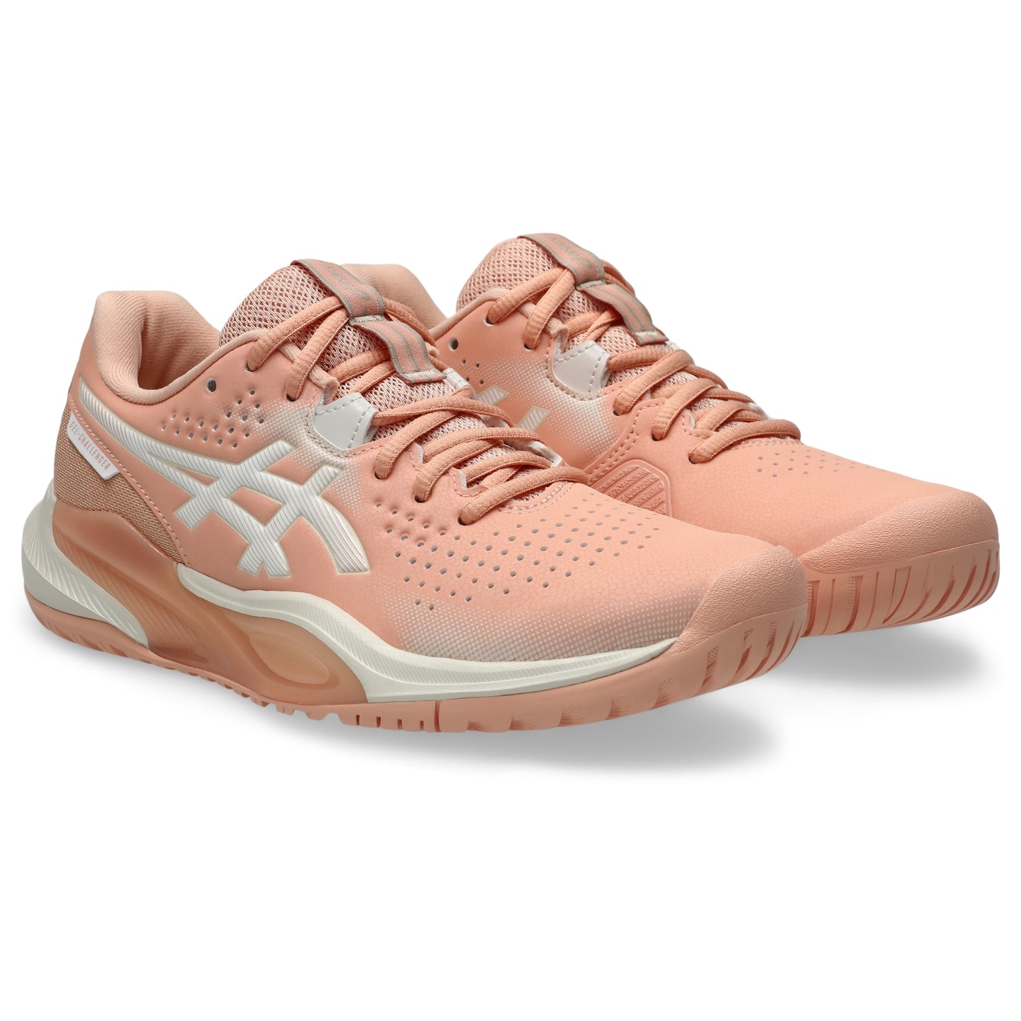 A pair of ASICS tennis shoes in a peach and white colorway, shown from a three-quarters angle on a clean white background.