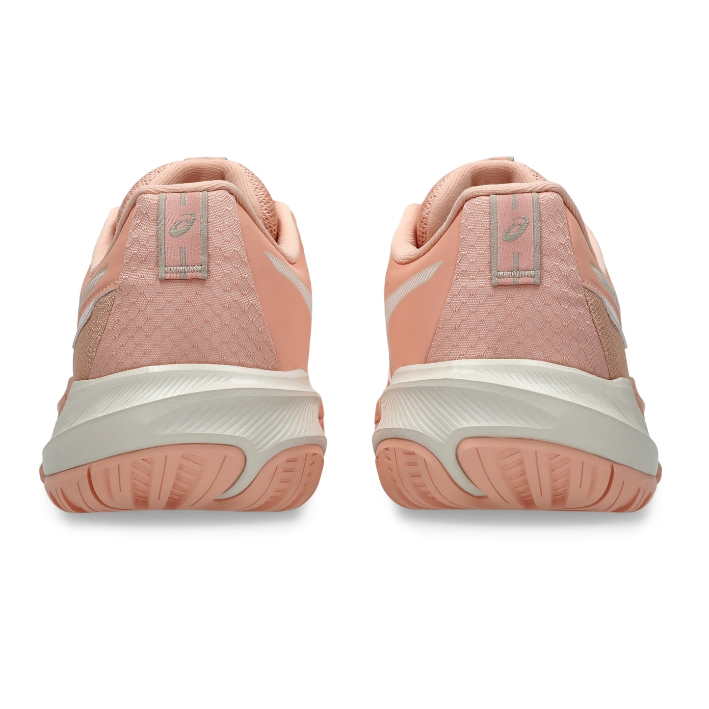 A pair of tennis shoes shown from the rear, featuring a peach and light pink textured upper, a thick off-white midsole, and a peach outsole, set against a plain white background.