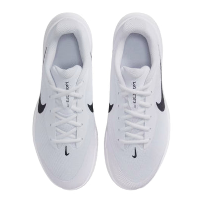 White tennis shoes with black swoosh logo on a white background