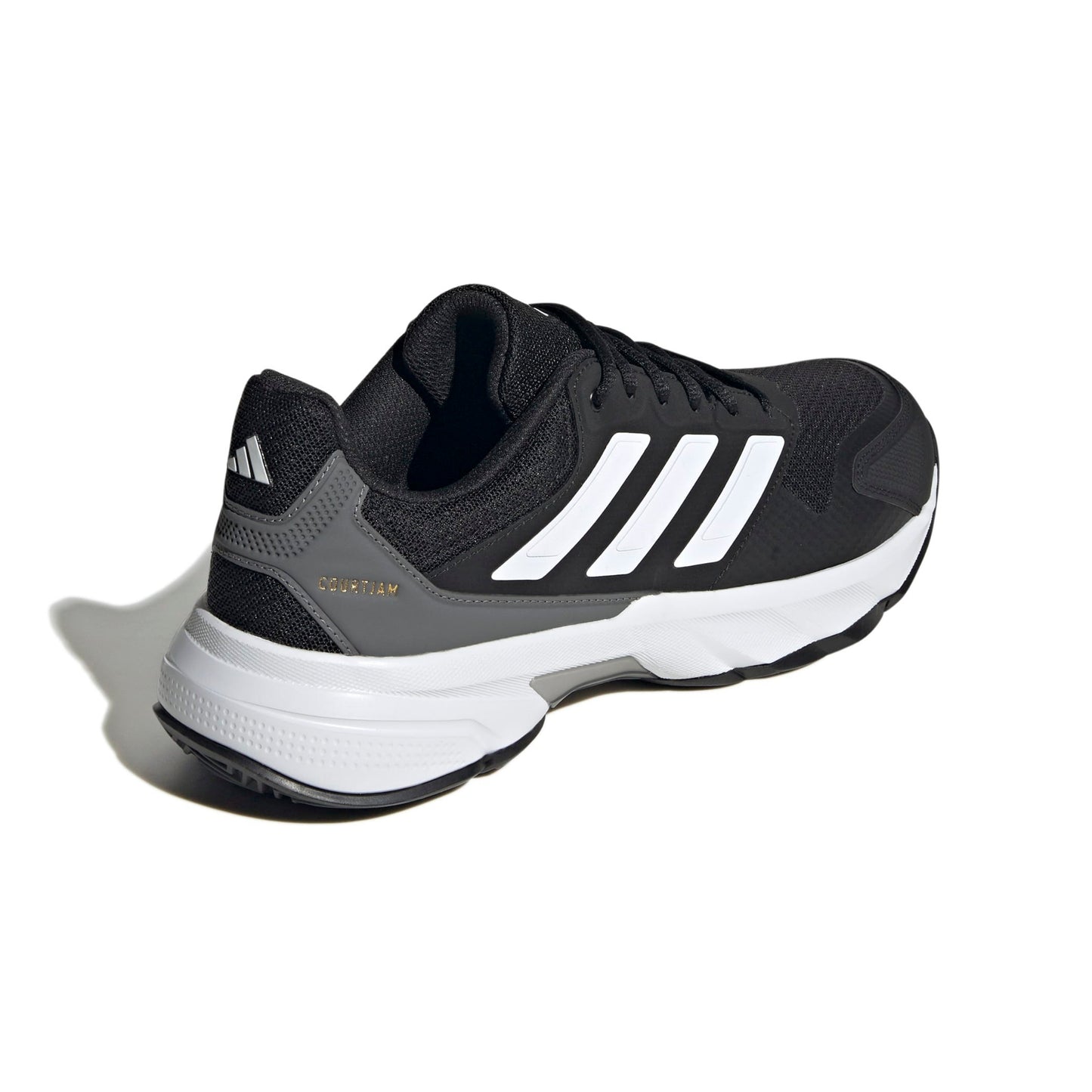 A black and gray Adidas tennis shoe with white three-stripes and a white midsole, shown from a side-rear angle on a white background with a soft shadow.