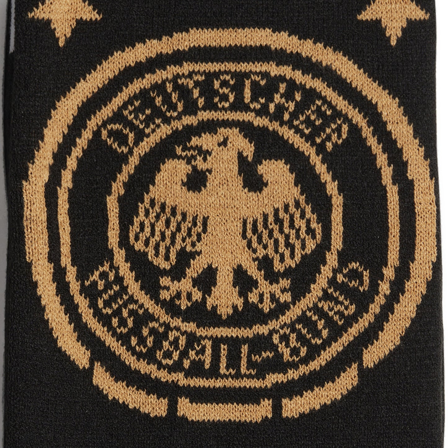 Black scarf with gold emblem featuring an eagle and text