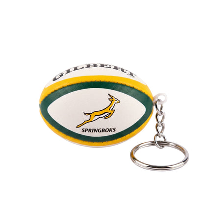 Keychain shaped like a rugby ball with 'Gilbert' and 'Springboks' branding on a white background