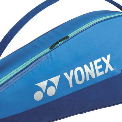 Blue Yonex tennis racket bag with a white logo on a white background