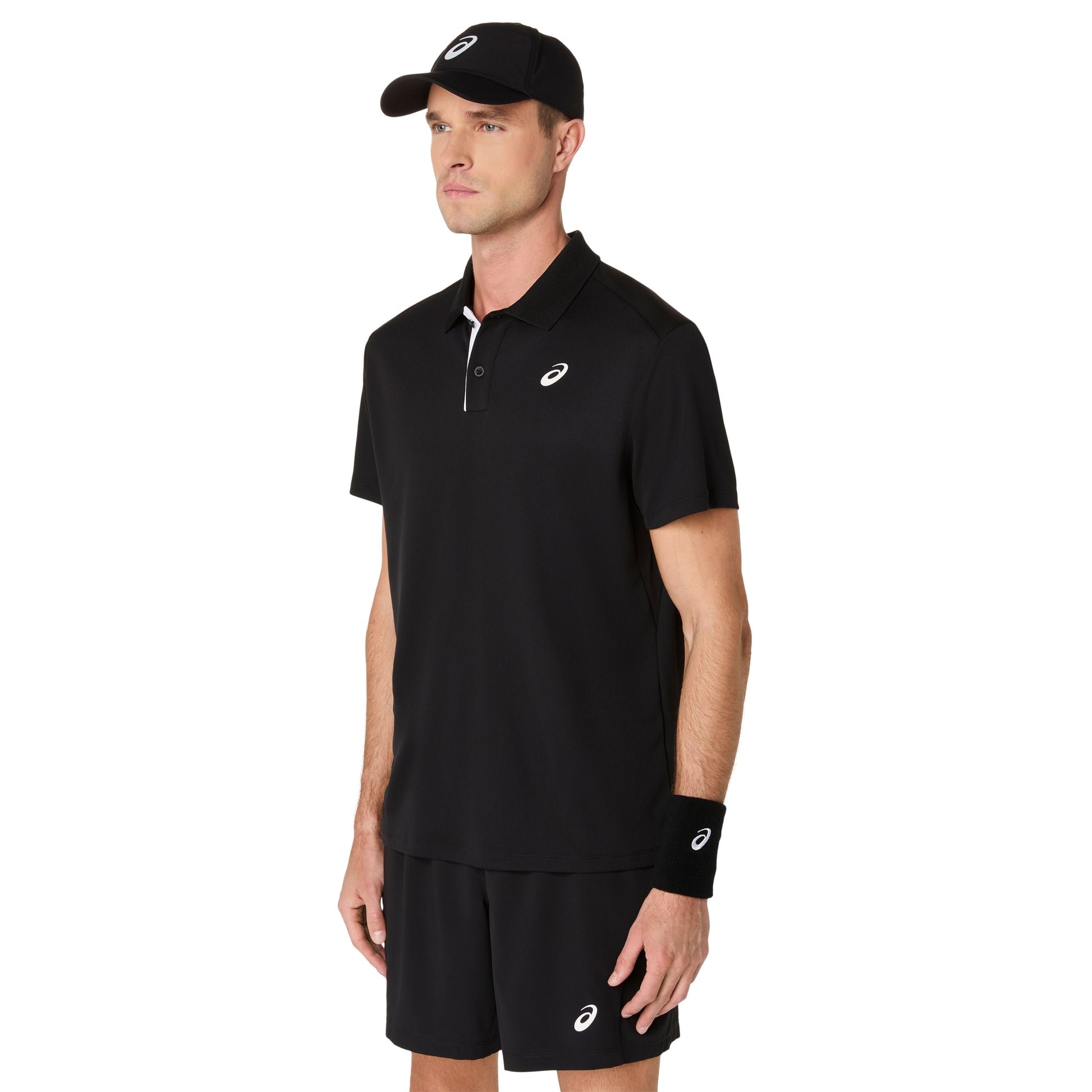 Man wearing a black polo shirt, shorts, and cap with a visible brand logo on a white background