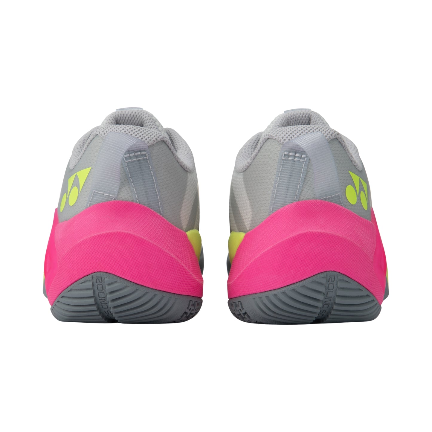 Pair of gray and pink Yonex athletic shoes with a visible brand logo on a white background