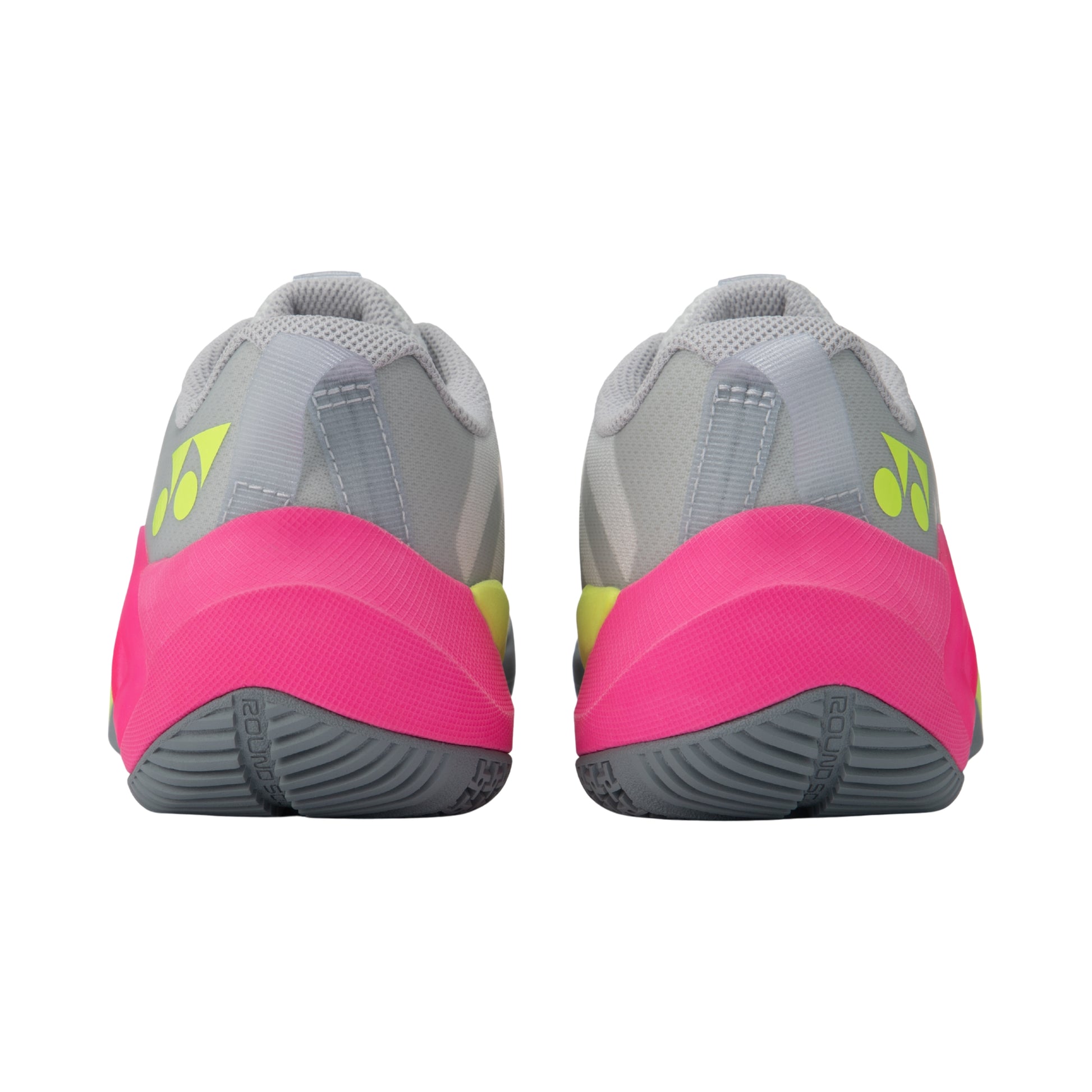 Pair of gray and pink Yonex athletic shoes with a visible brand logo on a white background