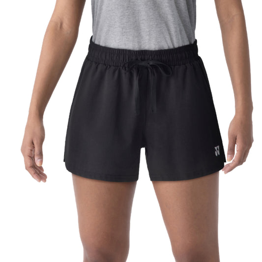 Black athletic Yonex shorts with a logo on a white background