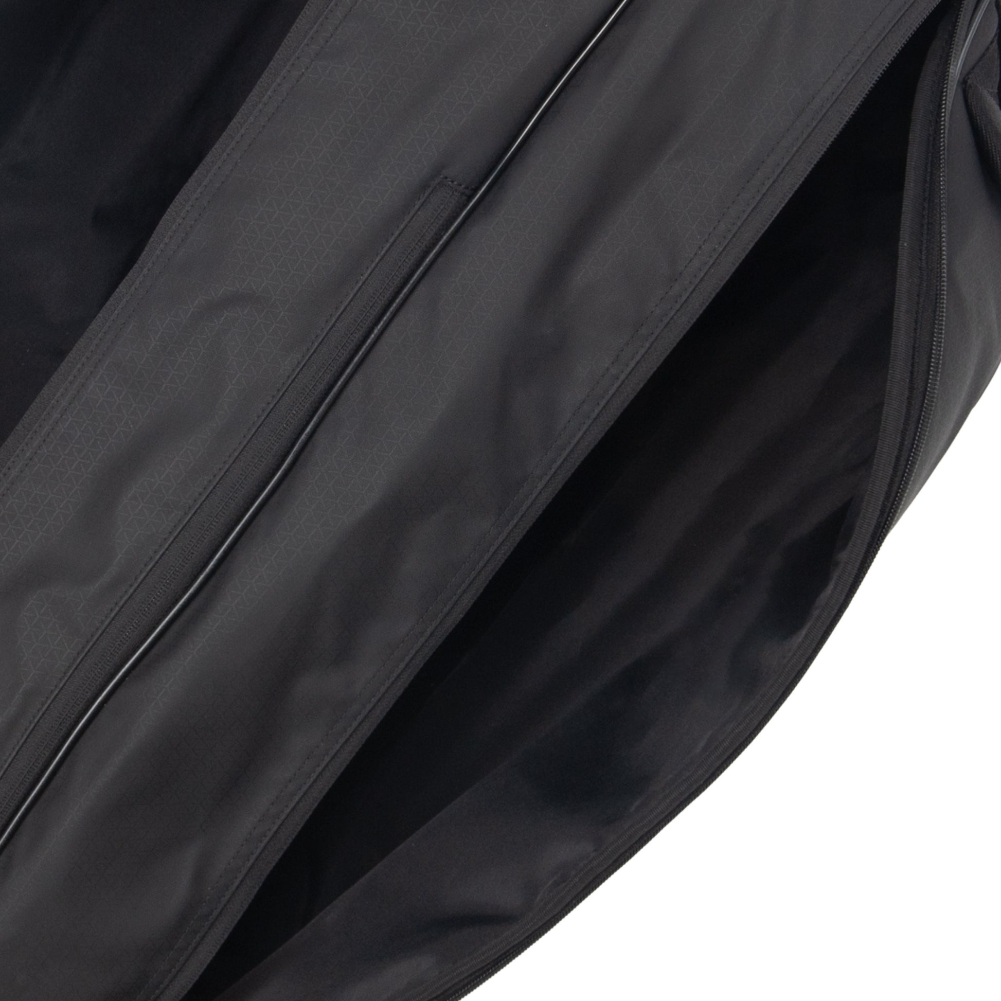Close-up of a black tennis bag with a zipper