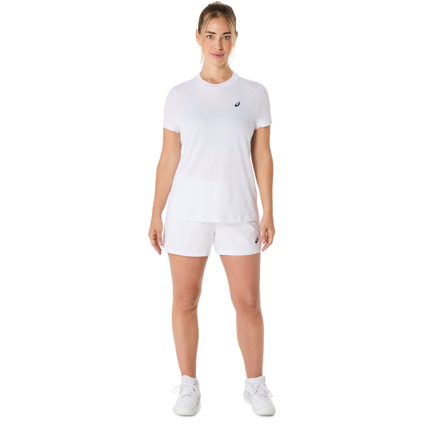 Woman wearing a white Asics t-shirt and shorts with a visible brand logo on a white background