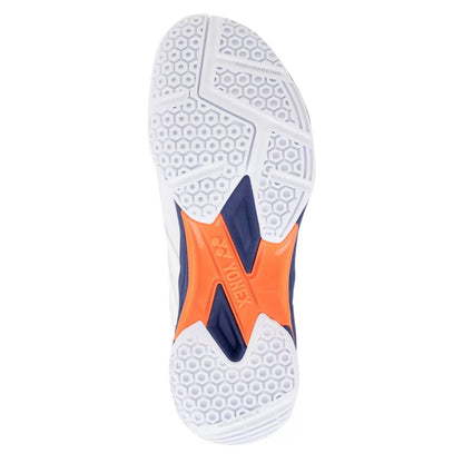 Close-up of a sports shoe sole with orange and blue accents on a white background