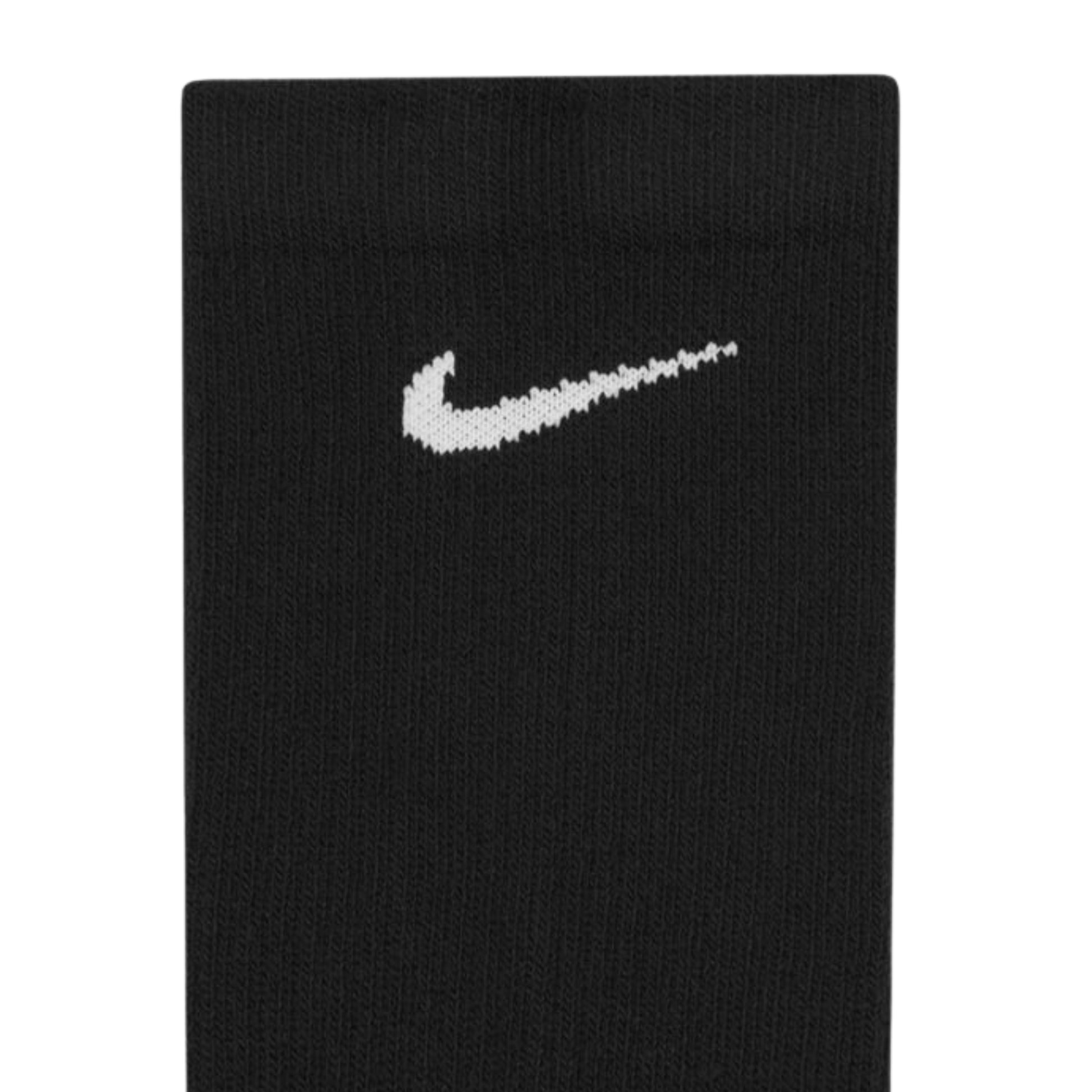Black socks with a white Nike logo on a white background