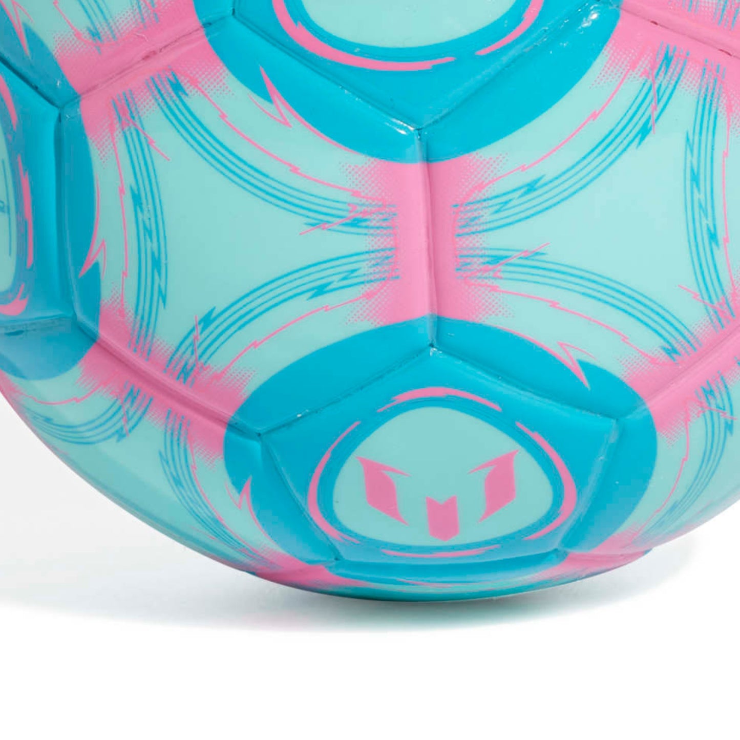 Close-up of Adidas blue and pink mini soccer ball on a white background