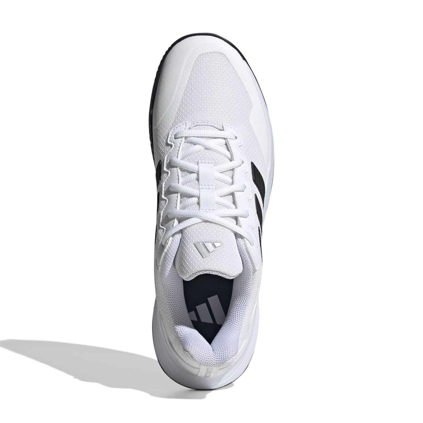 White tennis shoe with black accents on a white background