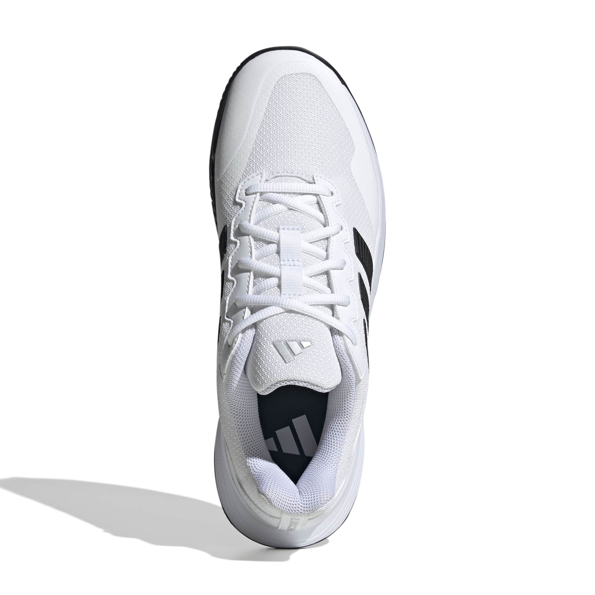 White tennis shoe with black accents on a white background